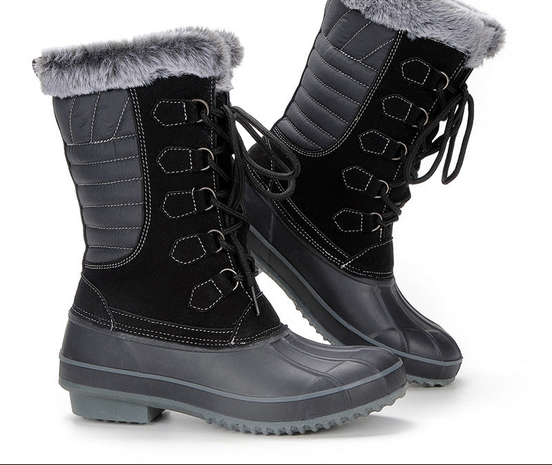 Black lace-up snow boots with faux-fur cuffs and treaded rubber outsole