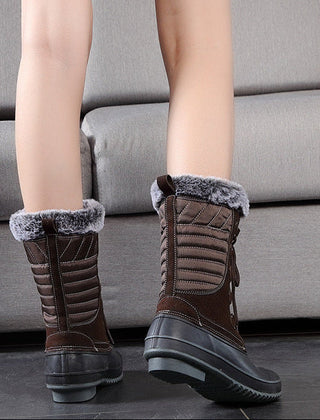 Brown lace-up snow boots with faux-fur cuffs and treaded outsole