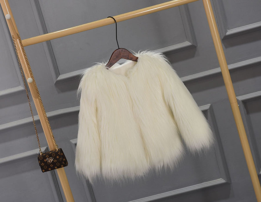 Cozy women's faux fur winter coat, plush and with a chic collar.