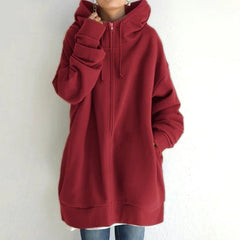 Woman wearing a cozy oversized women's hoodie, perfect for casual everyday fall & winter outfits and ultimate comfort.
