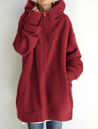 Woman wearing a cozy oversized women's hoodie, perfect for casual everyday fall & winter outfits and ultimate comfort.