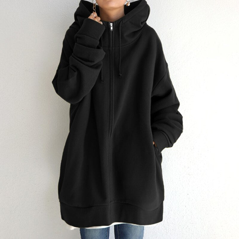 Folded women's cozy oversized hoodie, a warm hooded sweatshirt for ultimate winter comfort, perfect loungewear.