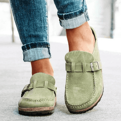 Women's ergonomic footwear: versatile clogs with comfortable cork sole and convenient slip-on style.