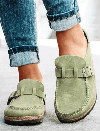 Women's ergonomic footwear: versatile clogs with comfortable cork sole and convenient slip-on style.
