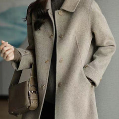 Elegant women's autumn coat with classic Peter Pan collar & practical pockets, perfect for chic winter fashion.