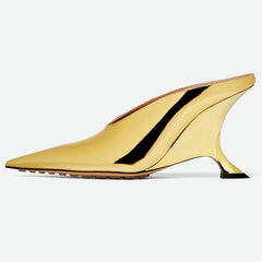 Women's metallic pointed toe wedge mules with a distinctive sculpted heel, great for dressy occasions.