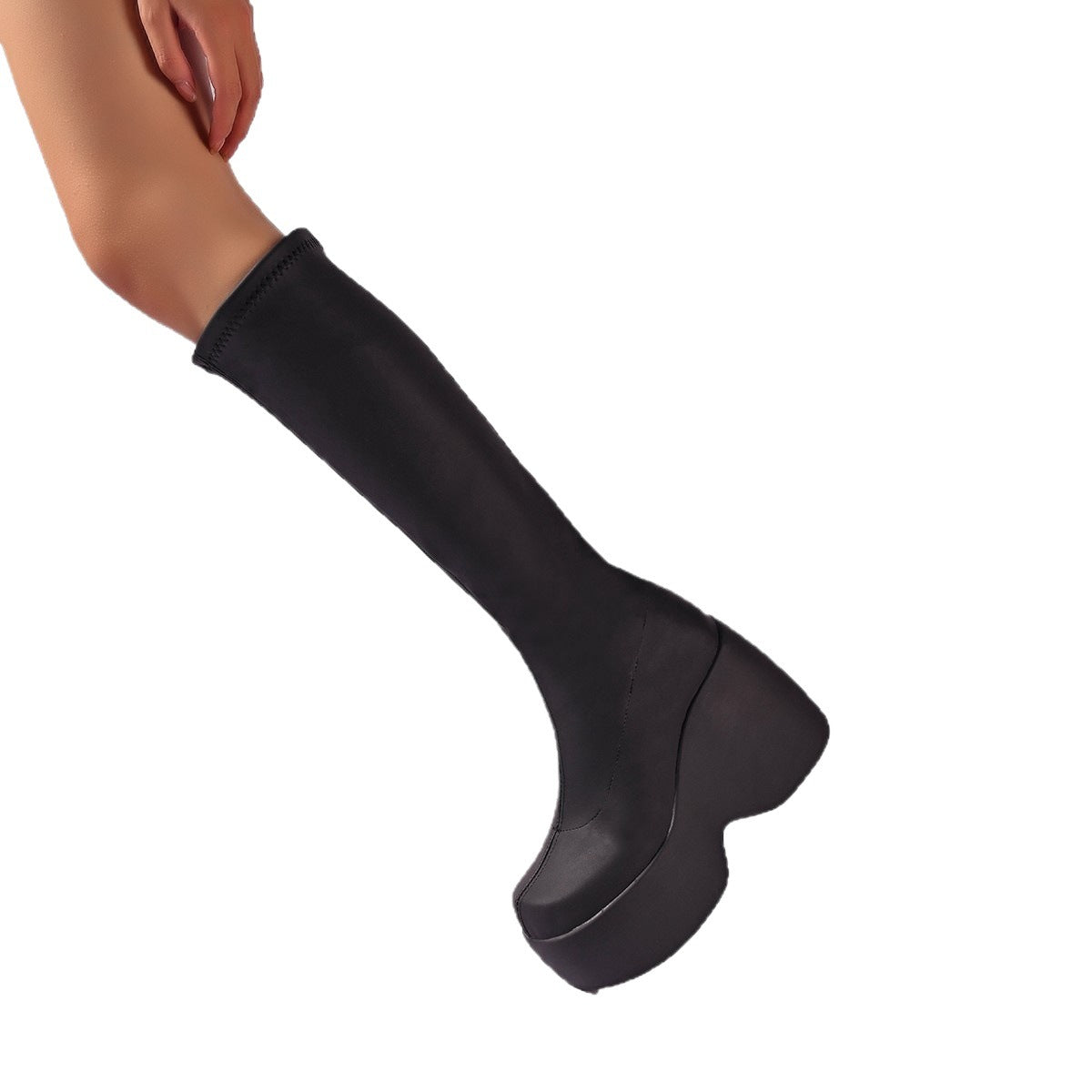 Close-up of black women's platform boots, highlighting ergonomic design and high-performance features.