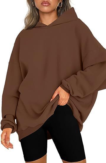 Women's oversized hooded sweatshirt, a cozy and comfortable casual top for any day.