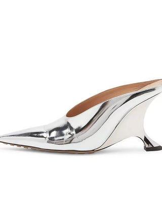 Women's pointed metallic wedge mules with unique sculpted heel, perfect for elegant evening wear or parties.