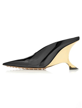 Women's elegant metallic pointed toe slip-on mules with a comfortable wedge and fashionable sculpted heel.