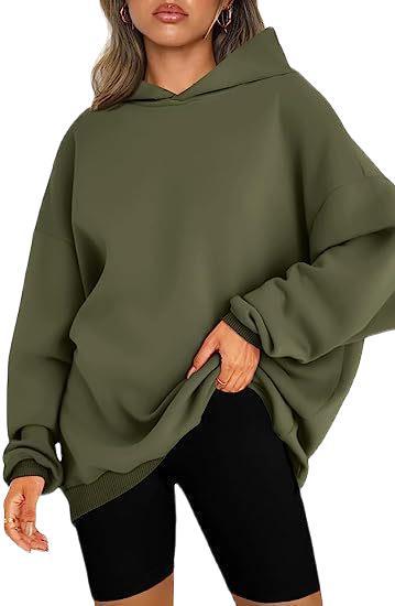 Trendy oversized women's sweatshirt, a soft hooded top for everyday comfort.