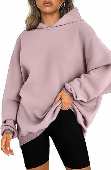 Oversized women's hoodie with a warm hood & long sleeves for ultimate cozy comfort.