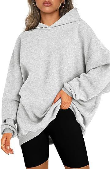 Stylish women's hooded top, a warm & cozy oversized sweatshirt for casual wear.