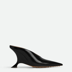 Statement women's metallic pointed toe mules featuring an elegant sculpted wedge heel, perfect for fashion-forward looks.
