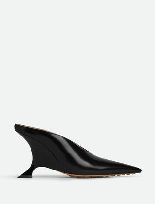 Statement women's metallic pointed toe mules featuring an elegant sculpted wedge heel, perfect for fashion-forward looks.