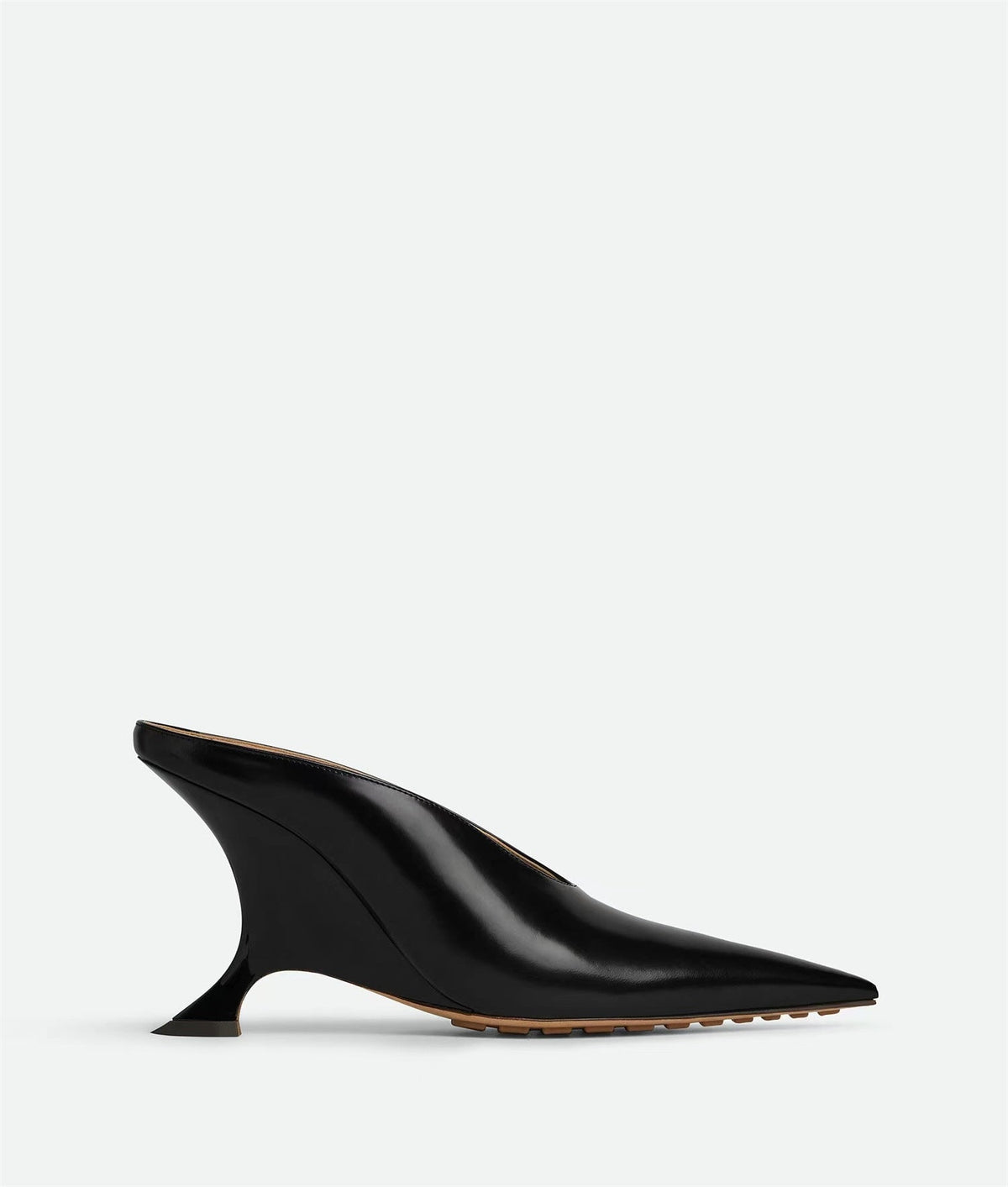 Statement women's metallic pointed toe mules featuring an elegant sculpted wedge heel, perfect for fashion-forward looks.