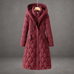 Warm hooded maxi puffer jacket for women, featuring elegant quilting and long design.