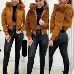 Women's stylish quilted bomber jacket with luxurious faux fur hood, perfect for winter fashion.