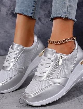 Women's metallic orthopaedic platform trainers, featuring a side zip, lace-up design for adjustable comfort.