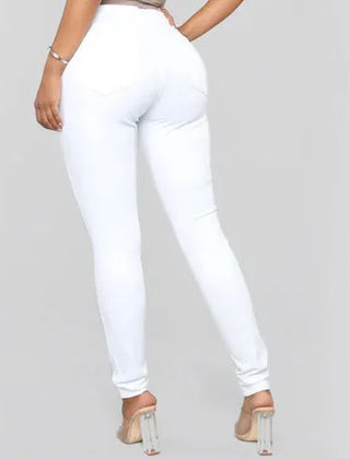 Classic blue high waist skinny jeans for women. Chic denim bottoms, ideal for office or casual wear.
