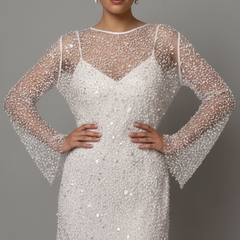 Woman wearing embellished mesh mini dress front view on gray background.