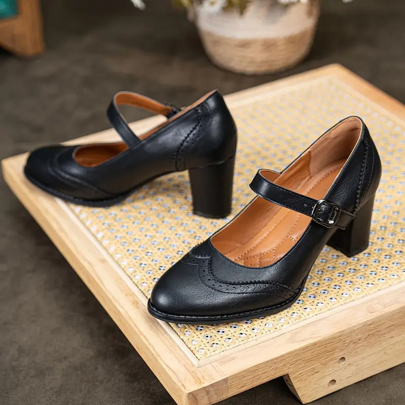 Women's black high heel Mary Jane dress shoes with a secure and decorative buckle strap, versatile and chic.