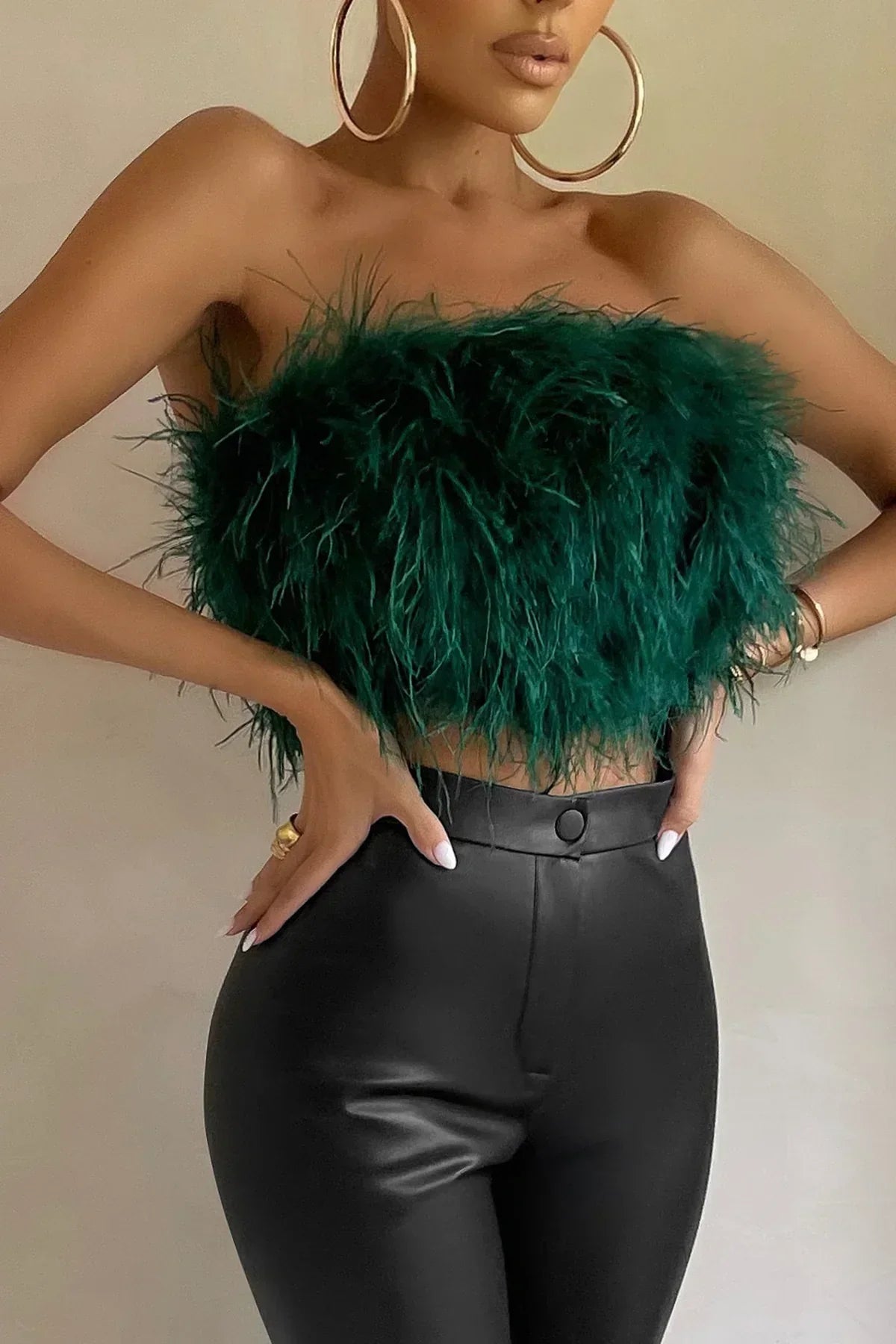 Eye-catching feather-trim tube top, a trendy women's crop top for sophisticated parties.