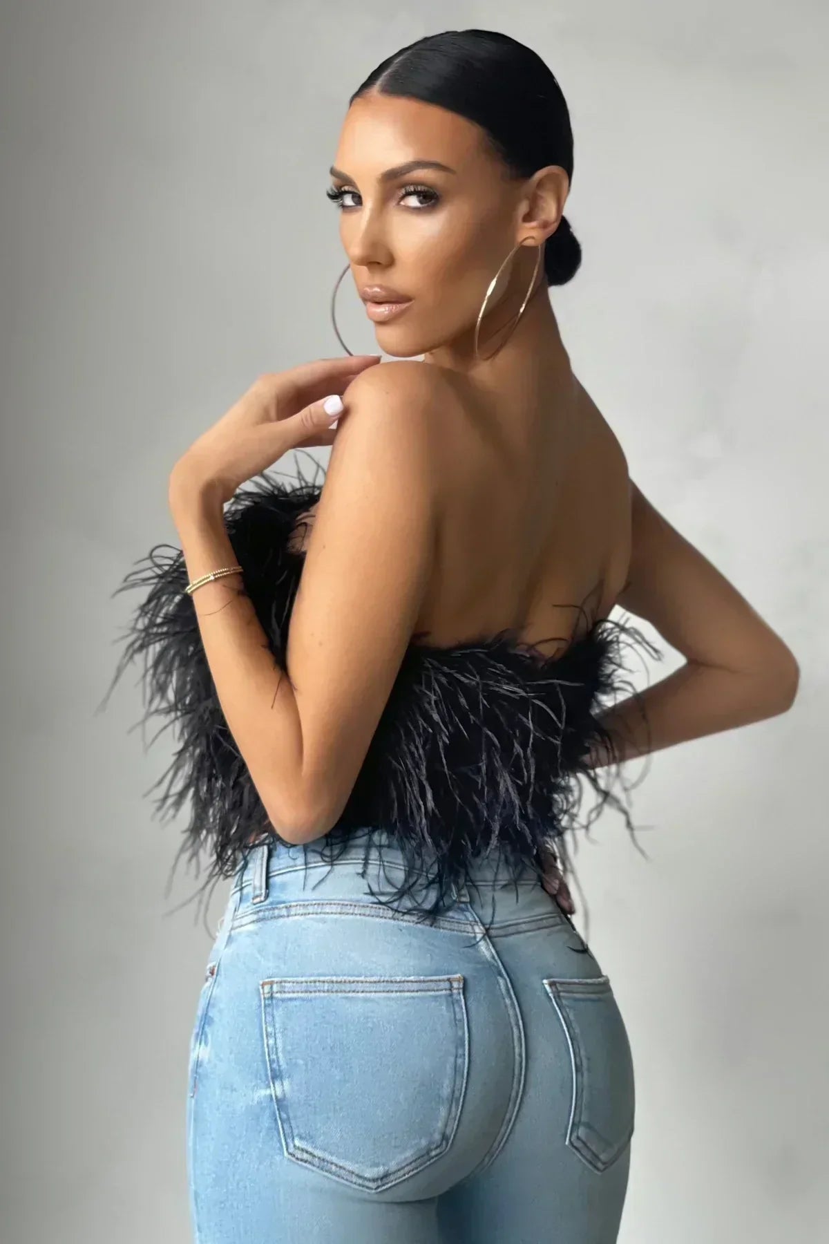 Chic women's feather tube top, perfect for making a party fashion statement.