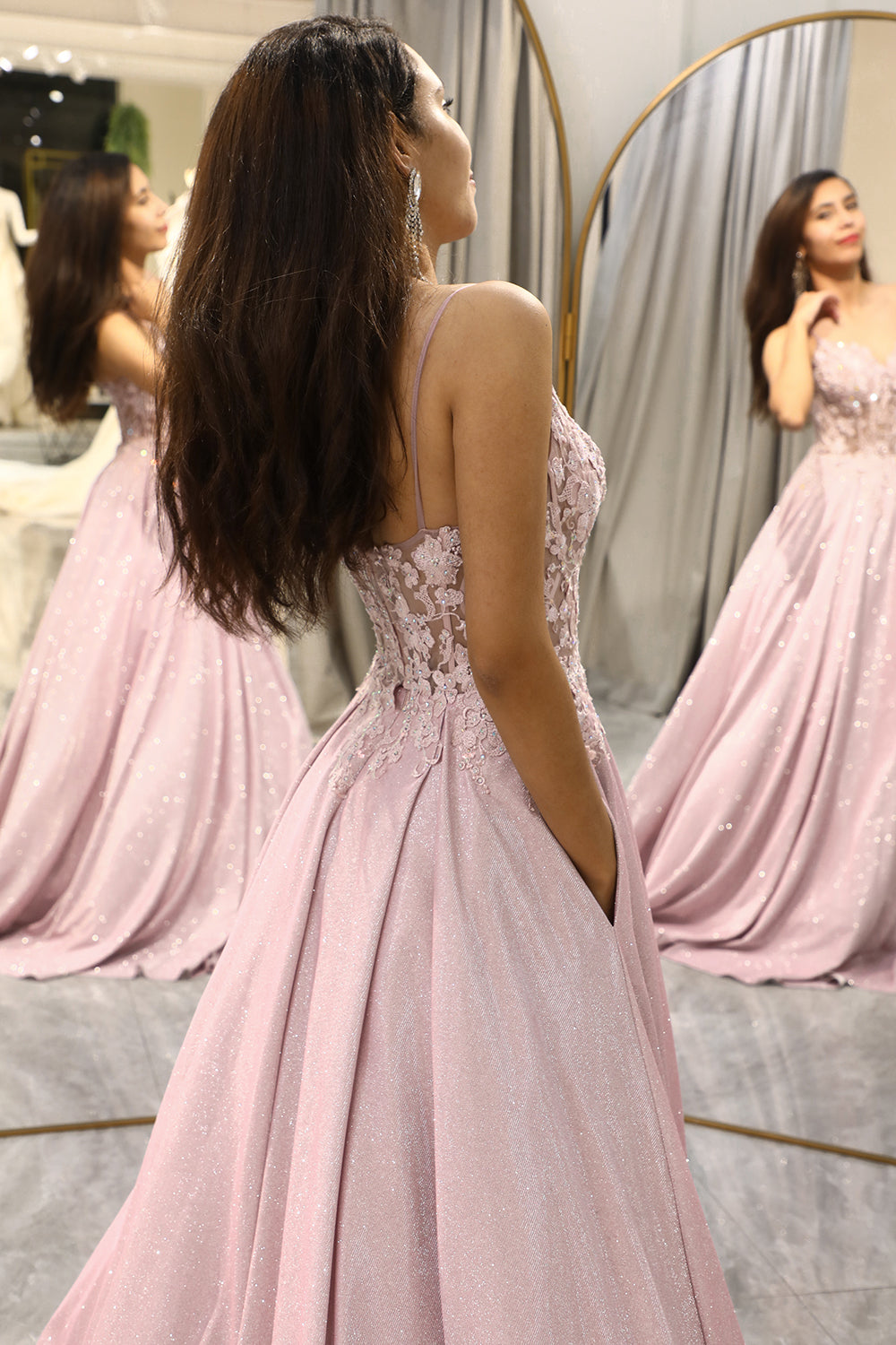 Sparkling embellished maxi dress in light pink, an elegant choice for women attending weddings or special occasions.