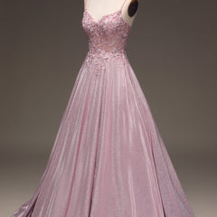 Women's elegant embellished light pink maxi dress, a gorgeous special occasion or formal wedding guest outfit.
